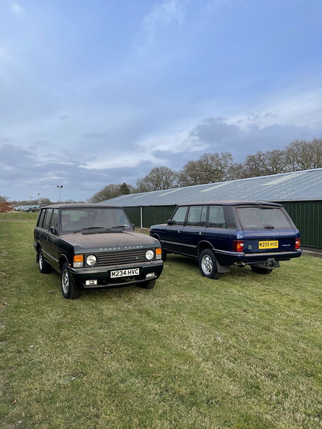A pair of Range Rover Classics on grass